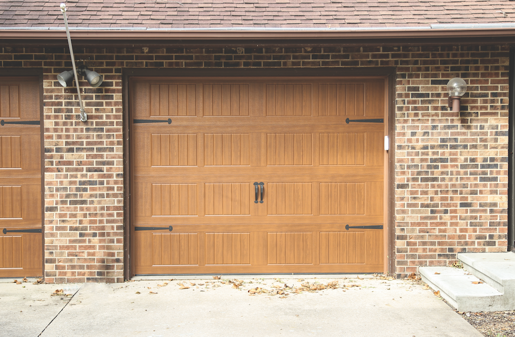 Can I install a garage door opener with a backup battery on a wooden door? 2