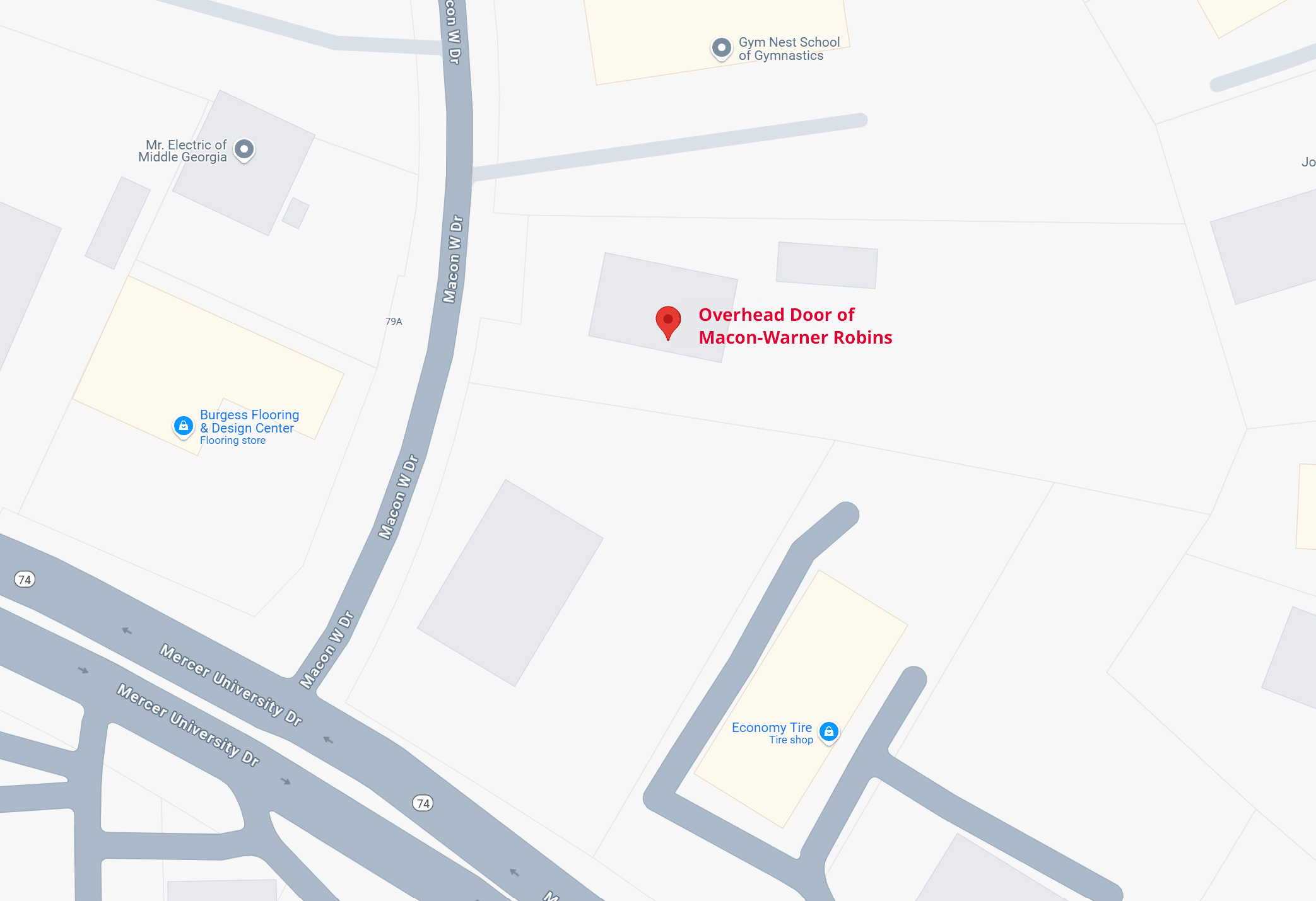 Map showing Overhead Door of Macon-Warner Robins marked with a red pin. Nearby locations include Burgess Flooring & Design Center and Economy Tire, with roads like Watson Blvd and Karl Drive visible.